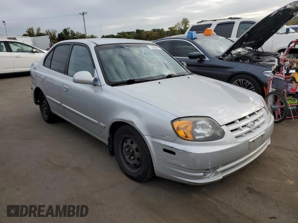 2005 Hyundai Accent GLS with VIN KMHCG45C45U631414, listed as a Copart auction lot 73963814 with 106,617 mi miles and Salvage Title. Bid and sale history available at carsss.com. Image 4.