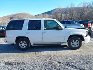 2000 Cadillac Escalade z VIN 1GYEK63R7YR219133, wystawiony jako IAAI lot #41585673 z przebiegiem 184 738 mil mil oraz . Historia ofert i sprzedaży dostępna na DreamBid. Obrazek 13.