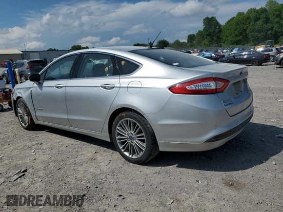 2013 Ford Fusion SE Hybrid z VIN 3FA6P0LU3DR336838, wystawiony jako Copart lot #56205445 z przebiegiem 209 164 mil mil oraz Czysty tytuł • Clean title. Historia ofert i sprzedaży dostępna na DreamBid. Obrazek 2.