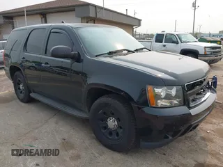 2014 Chevrolet Tahoe Commercial with VIN 1GNLC2E03ER212670, listed as a IAAI auction lot 42397479 with 106,756 mi miles and . Bid and sale history available at DreamBid. Image 1.