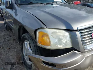 2007 GMC Envoy SLE with VIN 1GKDS13S372241844, listed as a IAAI auction lot 41575443 with 144,726 mi miles. Bid and sale history available at carsss.com. Image 6.