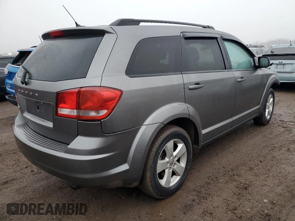 2013 Dodge Journey American Value with VIN 3C4PDCABXDT578099, listed as a Copart auction lot 48867795 with 187,338 mi miles and Salvage title. Bid and sale history available at DreamBid. Image 3.