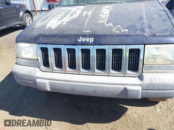 1997 Jeep Grand Cherokee Laredo z VIN 1J4GZ58Y2VC551199, wystawiony jako IAAI lot #42625502 z przebiegiem 210 722 mil mil oraz . Historia ofert i sprzedaży dostępna na DreamBid. Obrazek 6.