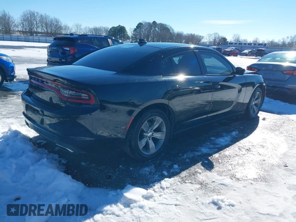 2015 Dodge Charger SXT with VIN 2C3CDXHG5FH841090, listed as a IAAI auction lot 41293591 with 107,732 mi miles and . Bid and sale history available at DreamBid. Image 4.