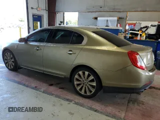2013 Lincoln MKS EcoBoost with VIN 1LNHL9FT2DG604657, listed as a Copart auction lot 65357735 with 133,548 mi miles and Salvage title. Bid and sale history available at DreamBid. Image 2.