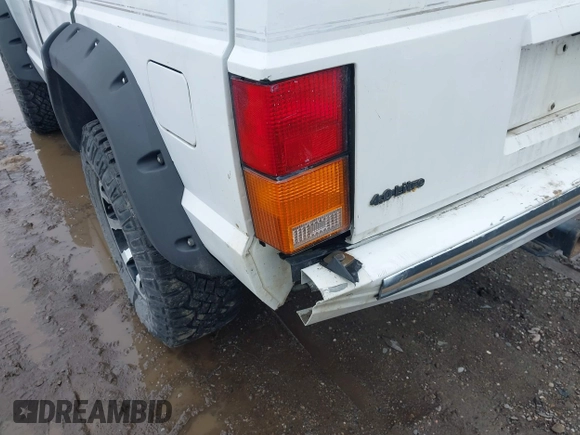 1990 Jeep Cherokee with VIN 1J4FJ78L0LL217723, listed as a IAAI auction lot 41788403 with 147,557 mi miles and . Bid and sale history available at DreamBid. Image 14.