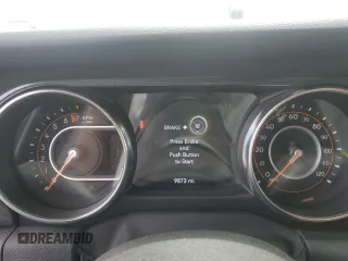 2022 Jeep Wrangler Unlimited Sport S z VIN 1C4HJXDG9NW149351, wystawiony jako Copart lot #54513615 z przebiegiem 9 873 mil mil oraz Szkoda całkowita • Salvage title. Historia ofert i sprzedaży dostępna na DreamBid. Obrazek 9.