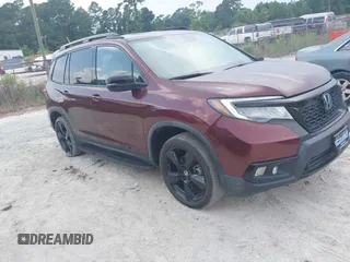 2021 Honda Passport Elite with VIN 5FNYF8H09MB001692, listed as a IAAI auction lot 42602671 with 45,098 mi miles and . Bid and sale history available at DreamBid. Image 1.