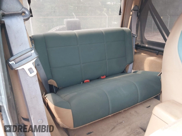 1998 Jeep Wrangler Sahara z VIN 1J4FY49SXWP716218, wystawiony jako IAAI lot #42354433 z przebiegiem 234 378 mil mil oraz . Historia ofert i sprzedaży dostępna na DreamBid. Obrazek 8.