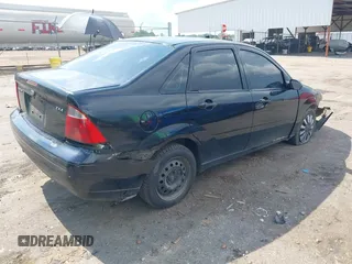 2006 Ford Focus S with VIN 1FAFP34N76W233950, listed as a IAAI auction lot 42596698 with 262,504 mi miles and . Bid and sale history available at DreamBid. Image 4.