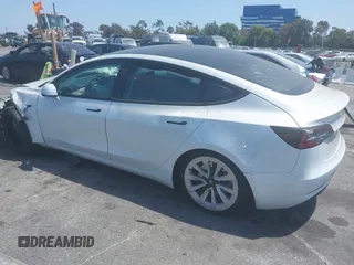2023 Tesla Model 3 with VIN 5YJ3E1EA6PF460054, listed as a IAAI auction lot 41231368 with 29,437 mi miles and . Bid and sale history available at DreamBid. Image 3.