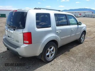 2009 Honda Pilot Touring with VIN 5FNYF48969B018075, listed as a IAAI auction lot 42052333 with 206,700 mi miles and . Bid and sale history available at carsss.com. Image 4.