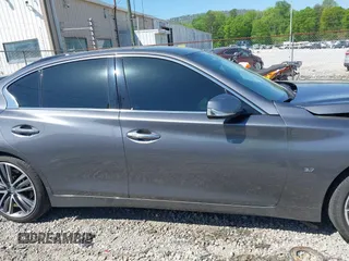 2014 Infiniti Q50 Premium z VIN JN1BV7AR0EM700278, wystawiony jako IAAI lot #42043943 z przebiegiem 107 369 mil mil oraz . Historia ofert i sprzedaży dostępna na DreamBid. Obrazek 13.