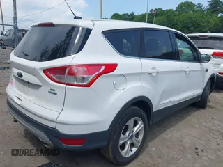 2014 Ford Escape SE z VIN 1FMCU9GX1EUD66666, wystawiony jako IAAI lot #42571222 z przebiegiem Nie podano mil oraz . Historia ofert i sprzedaży dostępna na DreamBid. Obrazek 4.