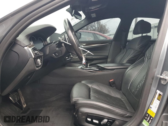 2018 BMW 5 Series M550i xDrive with VIN WBAJB9C54JB286707, listed as a Copart auction lot 49158435 with 74,307 mi miles and Salvage title. Bid and sale history available at DreamBid. Image 7.
