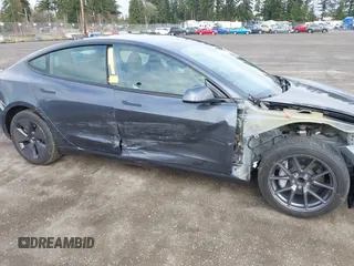 2023 Tesla Model 3 with VIN 5YJ3E1EA2PF623217, listed as a IAAI auction lot 41701413 with 21,246 mi miles and . Bid and sale history available at DreamBid. Image 6.