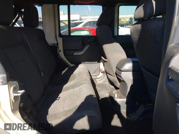 2012 Jeep Wrangler Unlimited Sport z VIN 1C4BJWDG8CL102486, wystawiony jako IAAI lot #41386649 z przebiegiem 156 993 mil mil oraz . Historia ofert i sprzedaży dostępna na DreamBid. Obrazek 8.