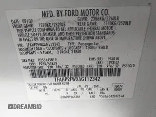 2010 Ford Taurus Limited with VIN 1FAHP2FWXAG112342, listed as a IAAI auction lot 42005142 with 148,947 mi miles. Bid and sale history available at carsss.com. Image 9.