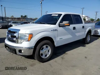 2014 Ford F-150 XL with VIN 1FTFW1CT1EKE22892, listed as a Copart auction lot 61635265 with 14,203 mi miles and Salvage title. Bid and sale history available at DreamBid. Image 1.