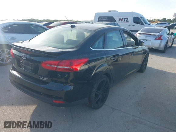 2016 Ford Focus Titanium with VIN 1FADP3J26GL335843, listed as a IAAI auction lot 42799795 with 167,506 mi miles and . Bid and sale history available at DreamBid. Image 4.
