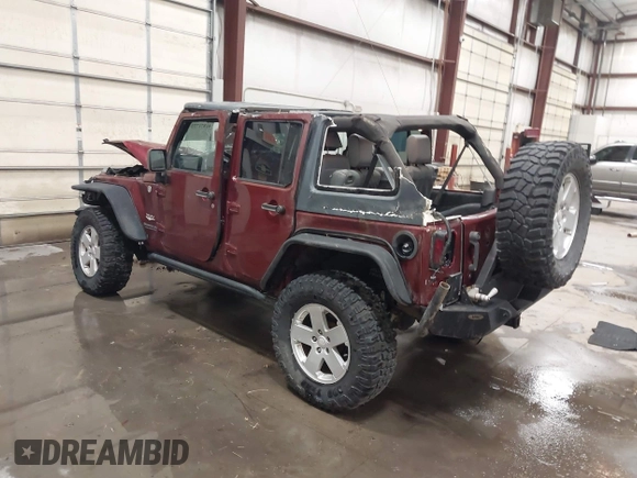 2007 Jeep Wrangler Unlimited Sahara z VIN 1J4GA59157L218278, wystawiony jako IAAI lot #41871773 z przebiegiem 145 992 mil mil oraz . Historia ofert i sprzedaży dostępna na DreamBid. Obrazek 3.