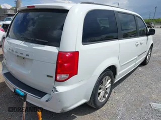 2014 Dodge Grand Caravan SXT with VIN 2C4RDGCG8ER264027, listed as a IAAI auction lot 42018350 with 311,876 mi miles and . Bid and sale history available at DreamBid. Image 4.