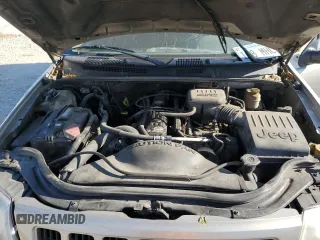 2004 Jeep Grand Cherokee Laredo with VIN 1J4GW48S34C307347, listed as a Copart auction lot 55749565 with Not provided miles and Salvage title. Bid and sale history available at DreamBid. Image 12.