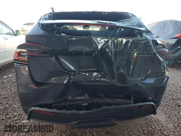 2023 Tesla Model X with VIN 7SAXCAE5XPF384061, listed as a Copart auction lot 86834084 with 6,974 mi miles and Salvage Title. Bid and sale history available at DreamBid. Image 6.