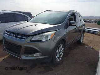 2014 Ford Escape Titanium with VIN 1FMCU0JX5EUC00297, listed as a IAAI auction lot 41928316 with 146,406 mi miles. Bid and sale history available at carsss.com. Image 2.