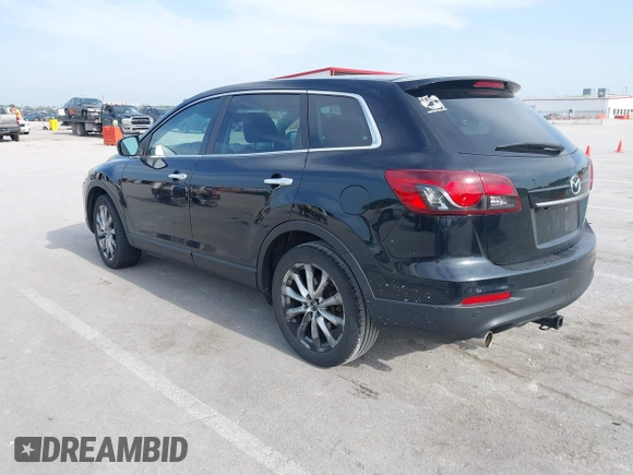 2015 Mazda CX-9 Grand Touring z VIN JM3TB2DA1F0456773, wystawiony jako IAAI lot #42257555 z przebiegiem 152 890 mil mil oraz . Historia ofert i sprzedaży dostępna na DreamBid. Obrazek 3.