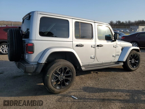 2024 Jeep Wrangler Sahara with VIN 1C4RJXP60RW128448, listed as a Copart auction lot 48658135 with 5,879 mi miles and Salvage Title. Bid and sale history available at DreamBid. Image 3.