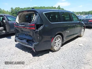 2023 Chrysler Pacifica Touring L with VIN 2C4RC1BG2PR534194, listed as a IAAI auction lot 42613934 with 69,896 mi miles and . Bid and sale history available at DreamBid. Image 4.