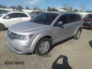 2014 Dodge Journey American Value Pkg with VIN 3C4PDCAB2ET186199, listed as a IAAI auction lot 41594478 with 145,936 mi miles. Bid and sale history available at carsss.com. Image 2.