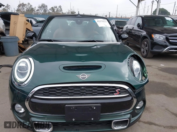 2019 MINI Convertible Cooper S z VIN WMWWG9C5XK3E40620, wystawiony jako IAAI lot #42379122 z przebiegiem 5 496 mil mil oraz . Historia ofert i sprzedaży dostępna na DreamBid. Obrazek 12.