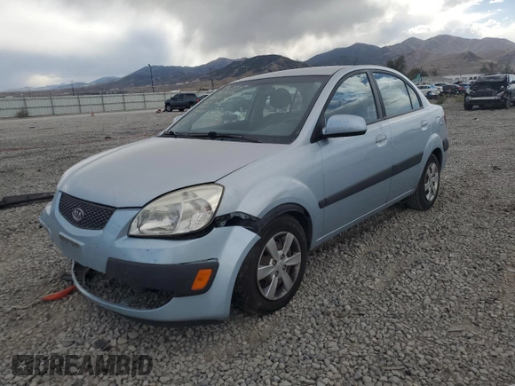 2009 Kia Rio LX with VIN KNADE223496469797, listed as a Copart auction lot 71005774 with 130,675 mi miles and Salvage Title. Bid and sale history available at DreamBid. Image 1.