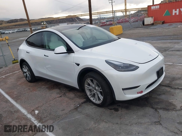 2023 Tesla Model Y Long Range with VIN 7SAYGDEE2PF874729, listed as a IAAI auction lot 41518376 with 10,927 mi miles and . Bid and sale history available at DreamBid. Image 1.