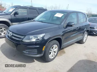 2012 Volkswagen Tiguan SE with VIN WVGAV7AXXCW526403, listed as a IAAI auction lot 41852974 with 125,376 mi miles and . Bid and sale history available at DreamBid. Image 2.