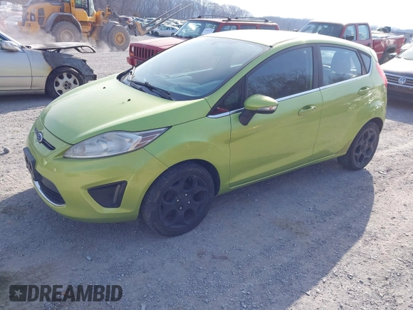 2011 Ford Fiesta SES with VIN 3FADP4FJ4BM108857, listed as a IAAI auction lot 41848272 with 138,943 mi miles. Bid and sale history available at carsss.com. Image 2.