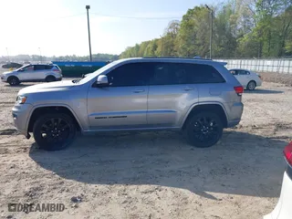 2018 Jeep Grand Cherokee Laredo E with VIN 1C4RJFAG0JC284927, listed as a IAAI auction lot 41964013 with 130,145 mi miles. Bid and sale history available at carsss.com. Image 14.