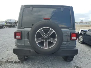2019 Jeep Wrangler Unlimited Sport S with VIN 1C4HJXDG3KW583521, listed as a Copart auction lot 62835915 with 115,292 mi miles and Salvage title. Bid and sale history available at DreamBid. Image 6.