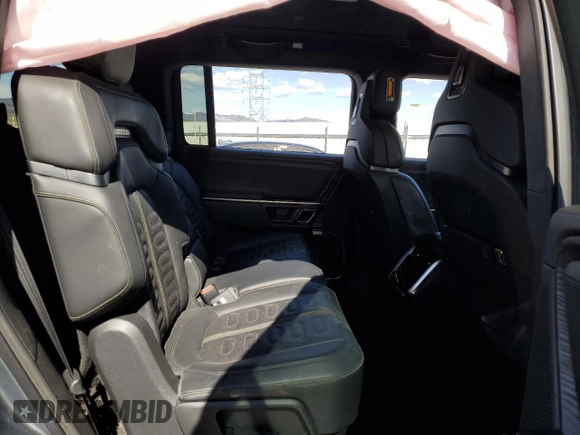 2023 Rivian R1S Adventure z VIN 7PDSGABA3PN018823, wystawiony jako Copart lot #53184595 z przebiegiem 36 677 mil mil oraz Szkoda całkowita • Salvage title. Historia ofert i sprzedaży dostępna na DreamBid. Obrazek 12.