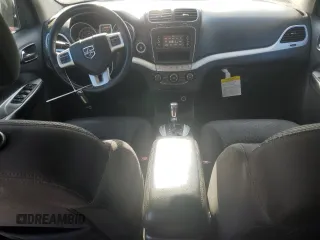 2014 Dodge Journey American Value with VIN 3C4PDCABXET277897, listed as a Copart auction lot 60566735 with 113,343 mi miles and Salvage title. Bid and sale history available at DreamBid. Image 8.