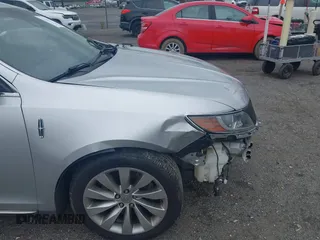 2013 Lincoln MKS с VIN 1LNHL9DK3DG604712, выставлен на аукционе IAAI как лот 42351237 с пробегом 144 927 миль миль и . История ставок и продаж доступна на DreamBid. Изображение 12.