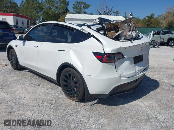 2023 Tesla Model Y Long Range with VIN 7SAYGAEE1PF665934, listed as a IAAI auction lot 41780949 with 21,949 mi miles and . Bid and sale history available at DreamBid. Image 3.