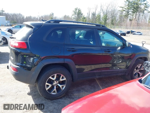 2014 Jeep Cherokee Trailhawk with VIN 1C4PJMBS3EW127749, listed as a IAAI auction lot 41836617 with 207,002 mi miles and . Bid and sale history available at DreamBid. Image 13.