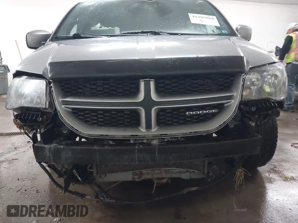 2015 Dodge Grand Caravan SE with VIN 2C4RDGBG9FR703691, listed as a IAAI auction lot 41395564 with 170,735 mi miles and . Bid and sale history available at DreamBid. Image 6.