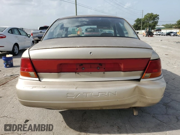 1998 Saturn SL with VIN 1G8ZK5270WZ240303, listed as a Copart auction lot 65364164 with 156,699 mi miles and Salvage title. Bid and sale history available at DreamBid. Image 6.