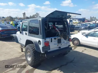 2004 Jeep Wrangler Rubicon with VIN 1J4FA69S94P701660, listed as a IAAI auction lot 41699554 with 74,640 mi miles. Bid and sale history available at carsss.com. Image 3.
