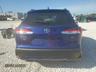 2023 Toyota Corolla Cross LE with VIN 7MUCAAAG0PV063737, listed as a Copart auction lot 86267914 with 13,740 mi miles and Salvage title. Bid and sale history available at DreamBid. Image 6.