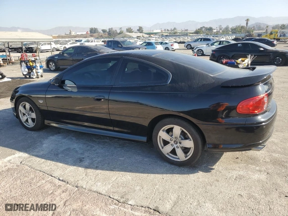 2004 Pontiac GTO with VIN 6G2VX12G44L192424, listed as a Copart auction lot 73253054 with 62,014 mi miles and Salvage Title. Bid and sale history available at carsss.com. Image 2.